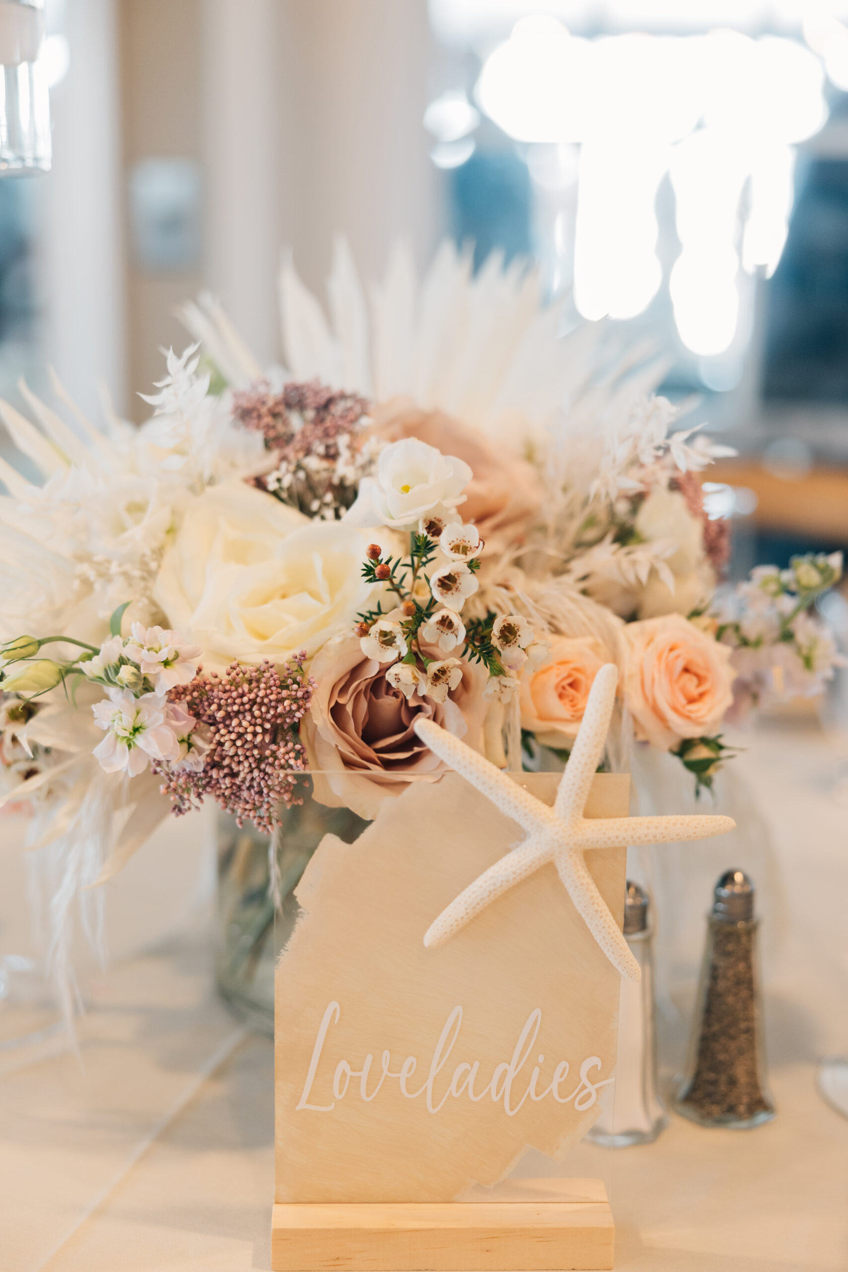 Shore-themed table numbers for a wedding.