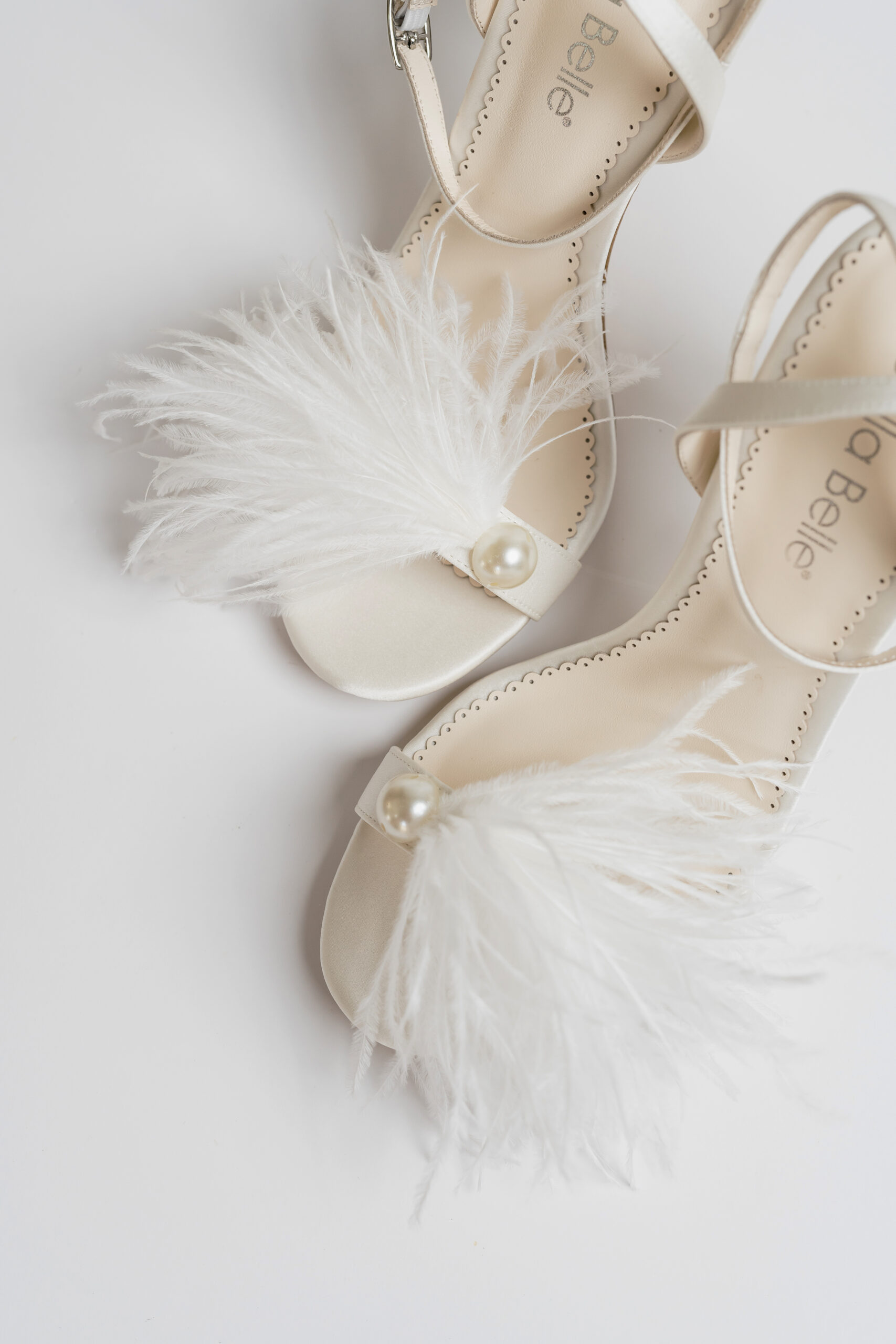 These feather shoes are a unique accessory for the bride.