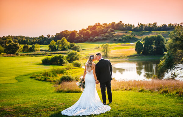Venues Category Vendor CrystalSpringsResort Bride and Groom at sunset on a golf course.