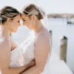 A Waterfront Wedding Featuring The Couple’s Dog & Pride Flags at the Ceremony