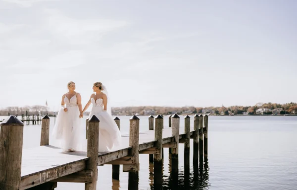 A Waterfront Wedding Featuring The Couple’s Dog & Pride Flags at the Ceremony