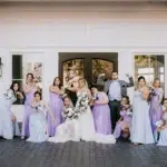 A Waterfront Wedding Featuring The Couple’s Dog & Pride Flags at the Ceremony