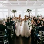 The wedding of A Waterfront Wedding Featuring The Couple’s Dog & Pride Flags at the Ceremony Gallery 1