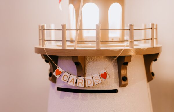 A Waterfront Wedding Featuring The Couple’s Dog & Pride Flags at the Ceremony