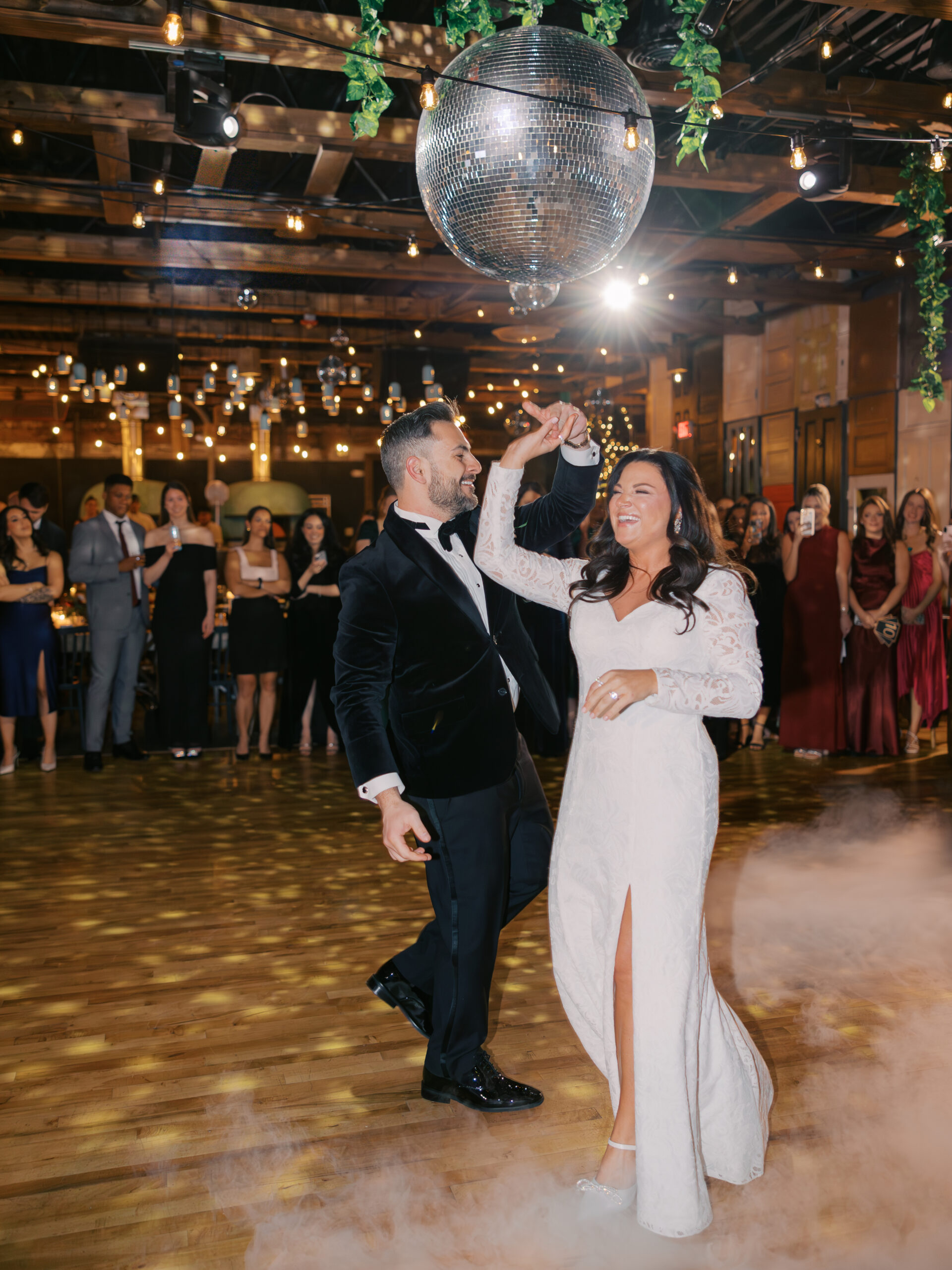 Bride and groom first dance under disco balls at Porta Montclair NJ wedding