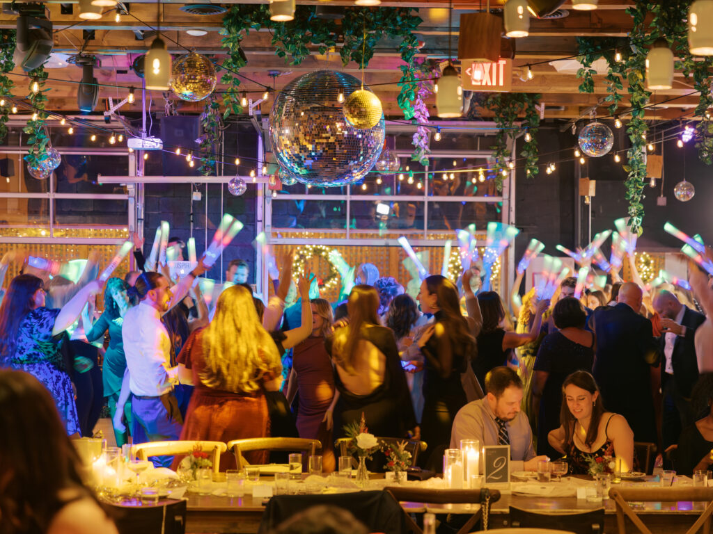 Laura and Christopher's restaurant wedding reception at Porta Montclair NJ, with disco balls and string lights.