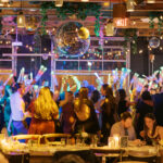 Laura and Christopher's restaurant wedding reception at Porta Montclair NJ, with disco balls and string lights.