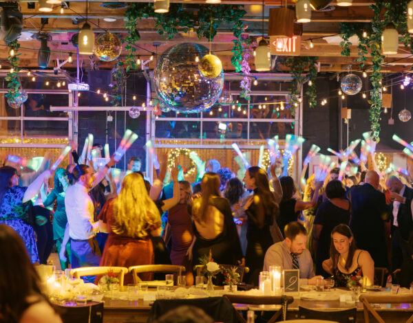 Laura and Christopher's restaurant wedding reception at Porta Montclair NJ, with disco balls and string lights.