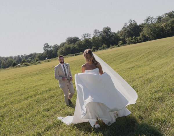 Bride holding a colorful DIY floral bouquet at a backyard wedding in New Jersey