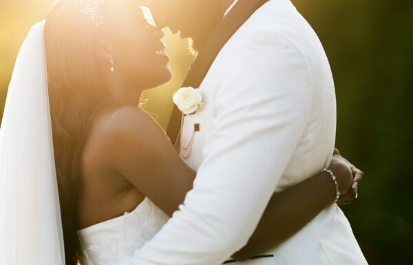 A Nigerian Money Spray, Haitian Blessings & White Roses That Mirrored Their Parents’ Wedding Flowers