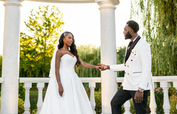 A Nigerian Money Spray, Haitian Blessings & White Roses That Mirrored Their Parents’ Wedding Flowers