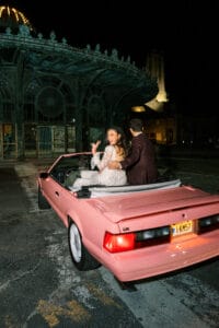 car with bridal couple