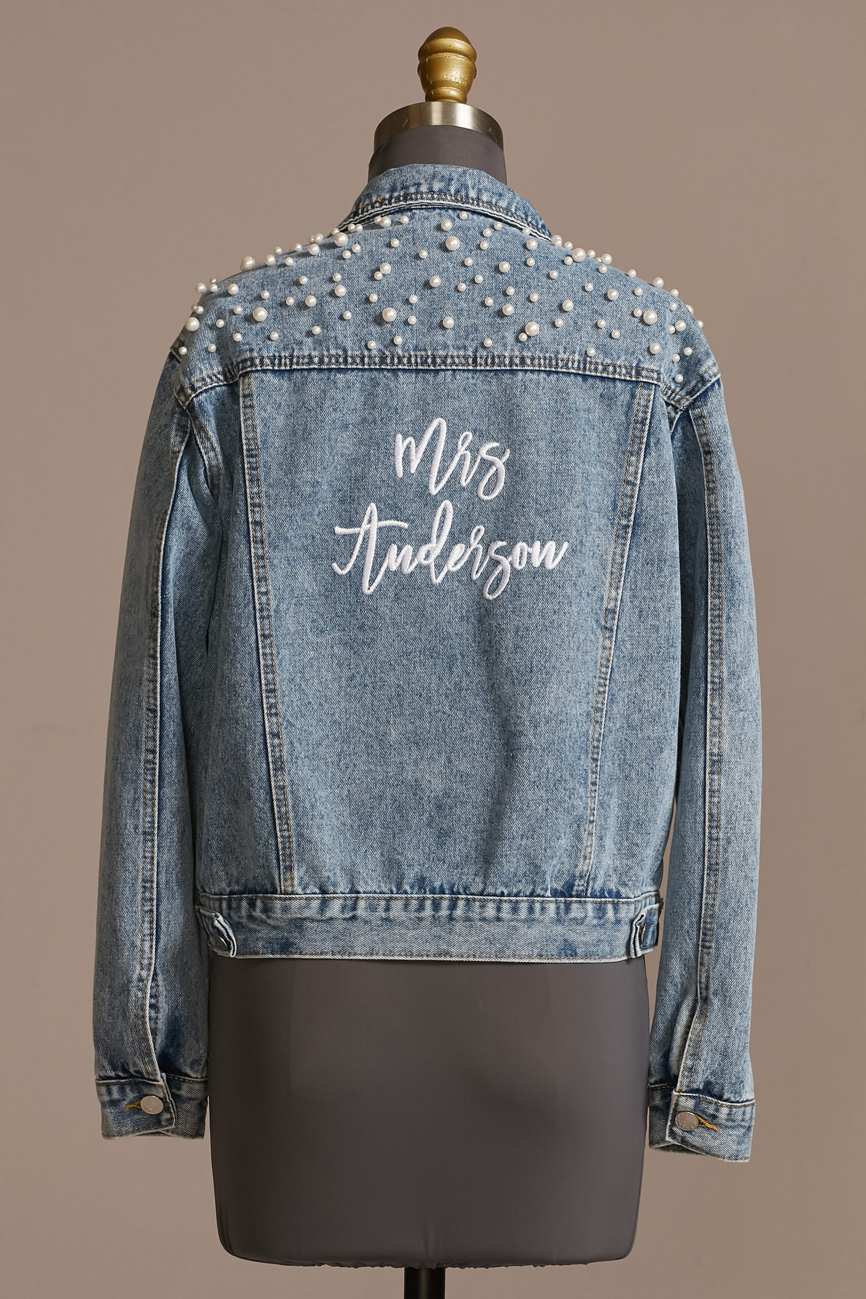 This personalized denim jacket is a unique accessory for the bride.