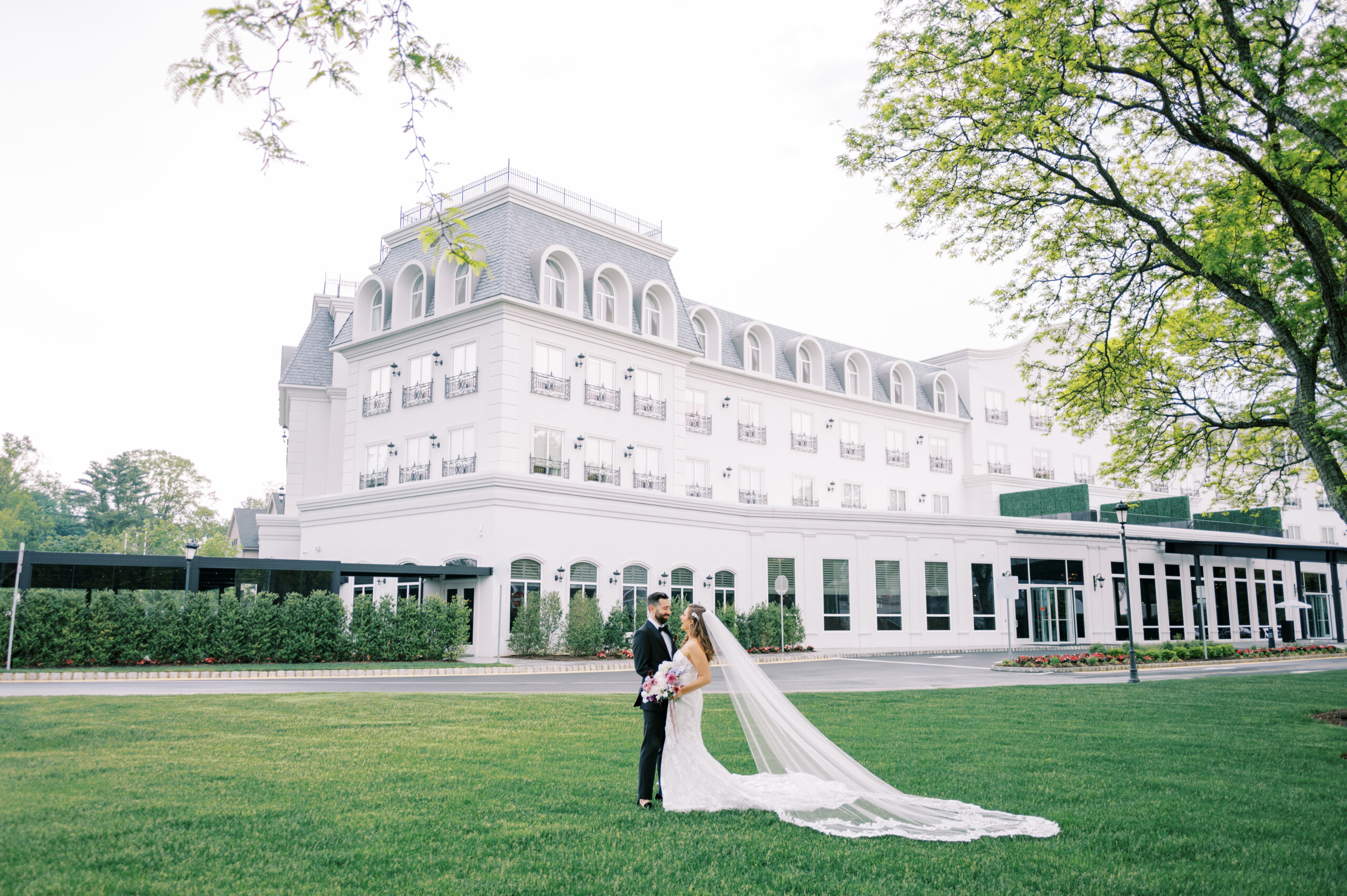 The couple poses on the lawn of the Chateau Grande Hotel.