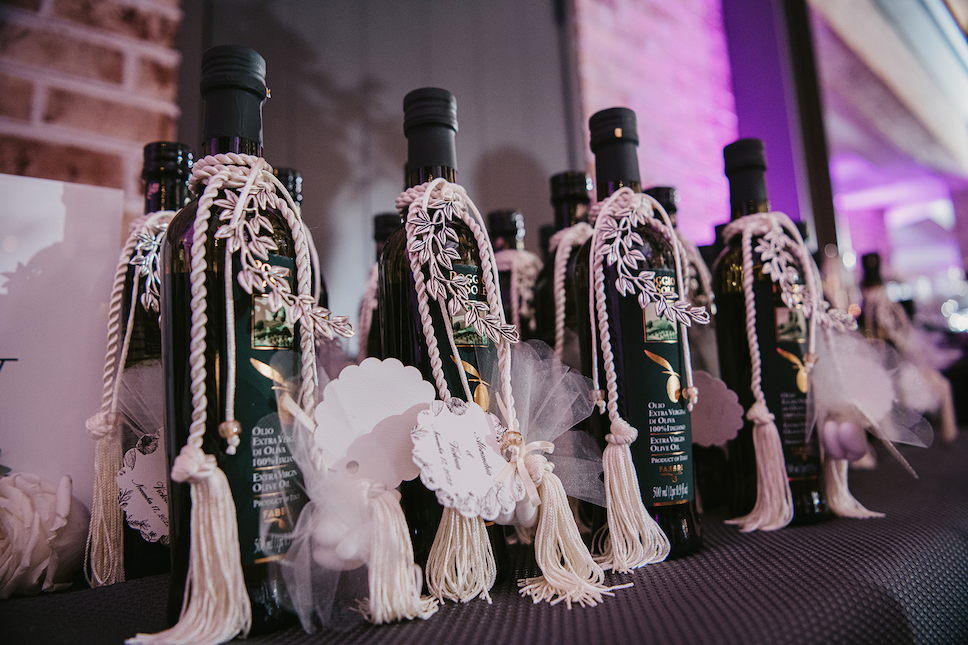 Olive oil bottle favors at this Perona Farms wedding.