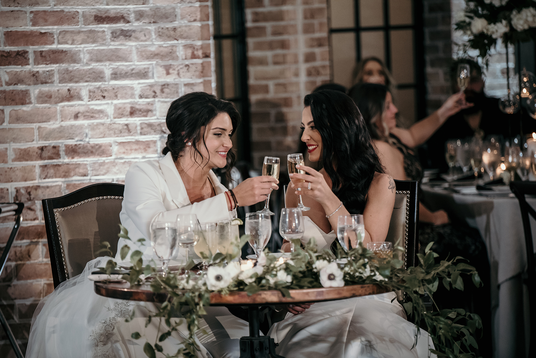 The brides cheers during their Perona Farms wedding.
