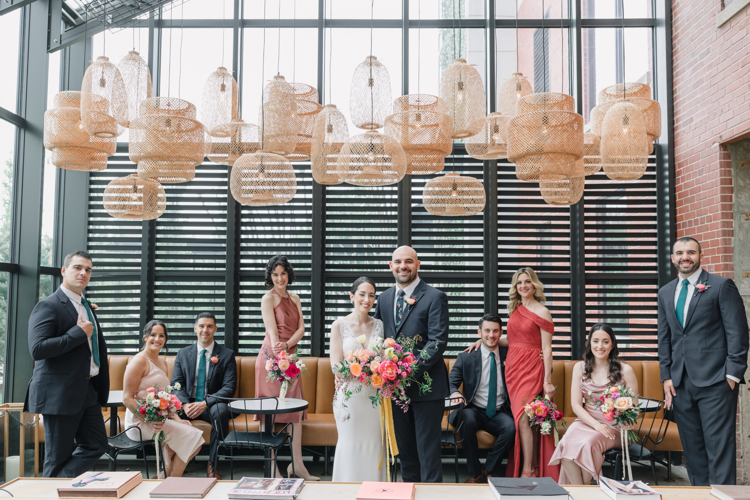 The bride and groom with their wedding party at The Asbury Hotel before their wedding at Porta Asbury Park.