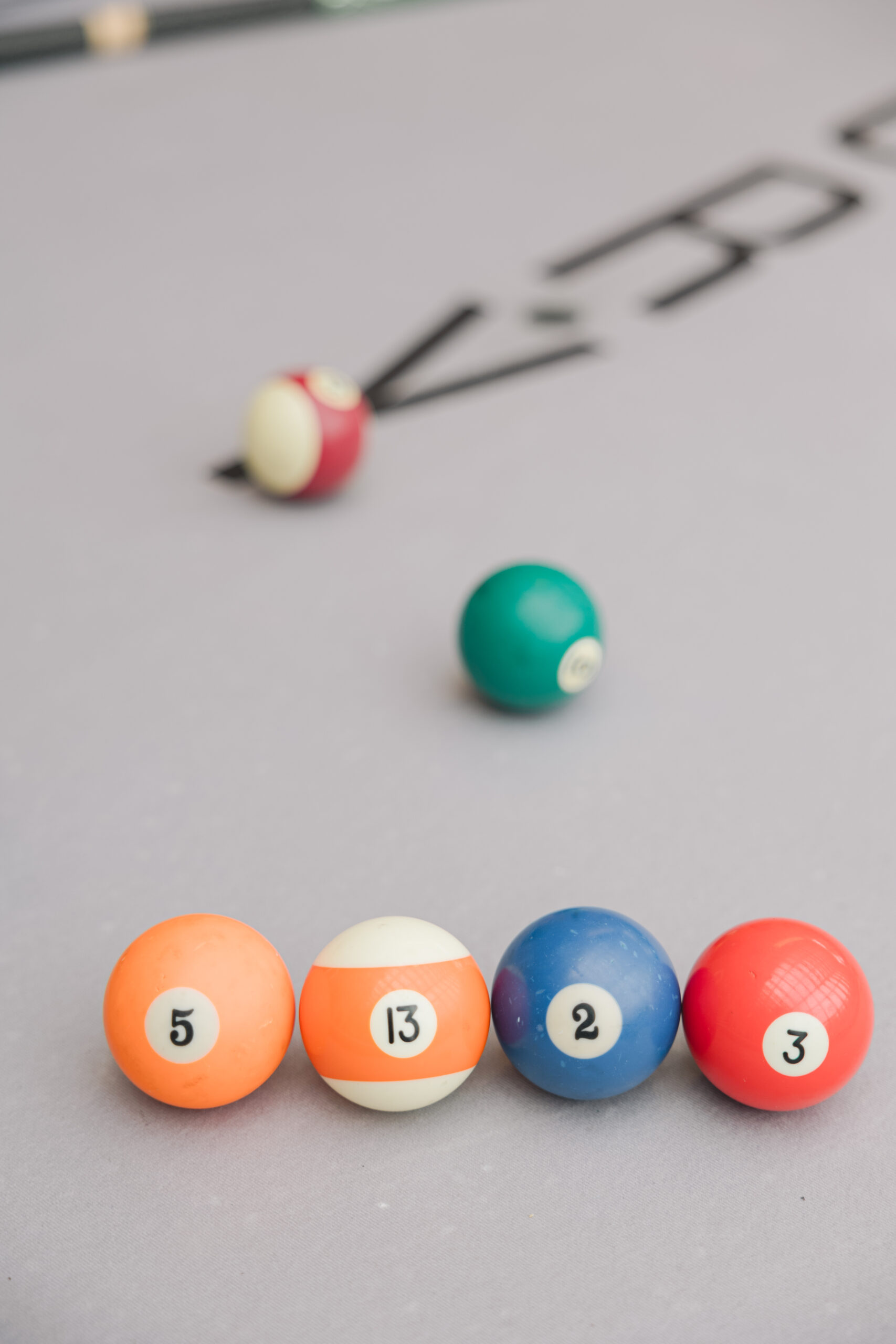 Pool balls lined up to spell out the wedding date for this couple's Porta Asbury Park wedding.