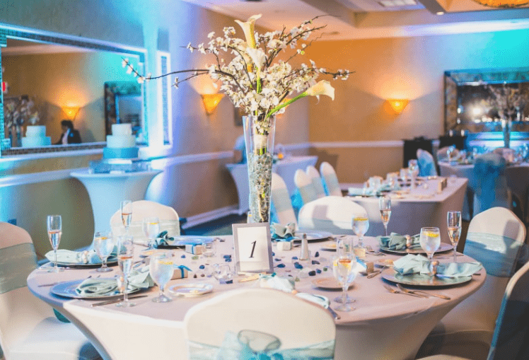 Blue uplighting sets the mood at the Atlantis Ballroom, an affordable venue in NJ.