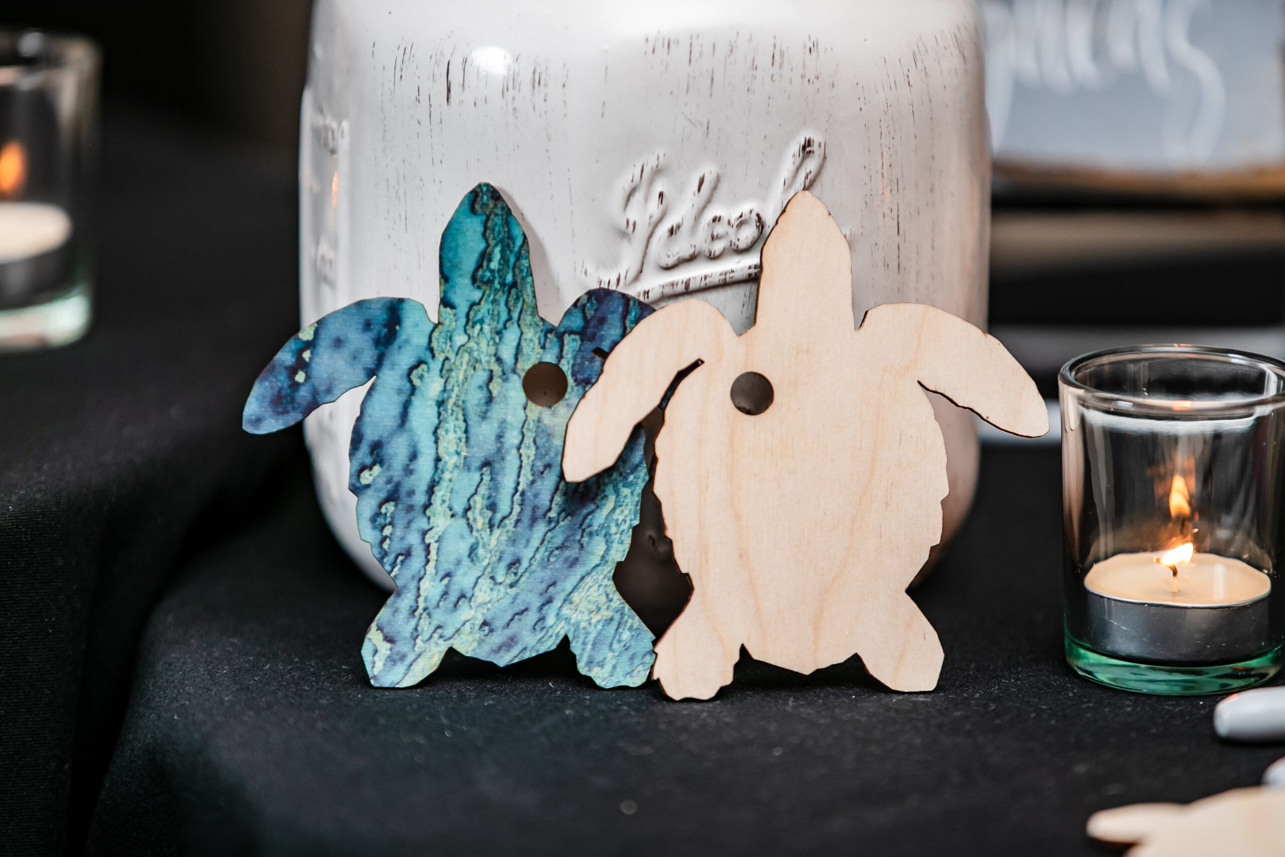 A closeup of turtle-shaped cutouts for their couple's guestbook at their Palace at Somerset Park wedding.