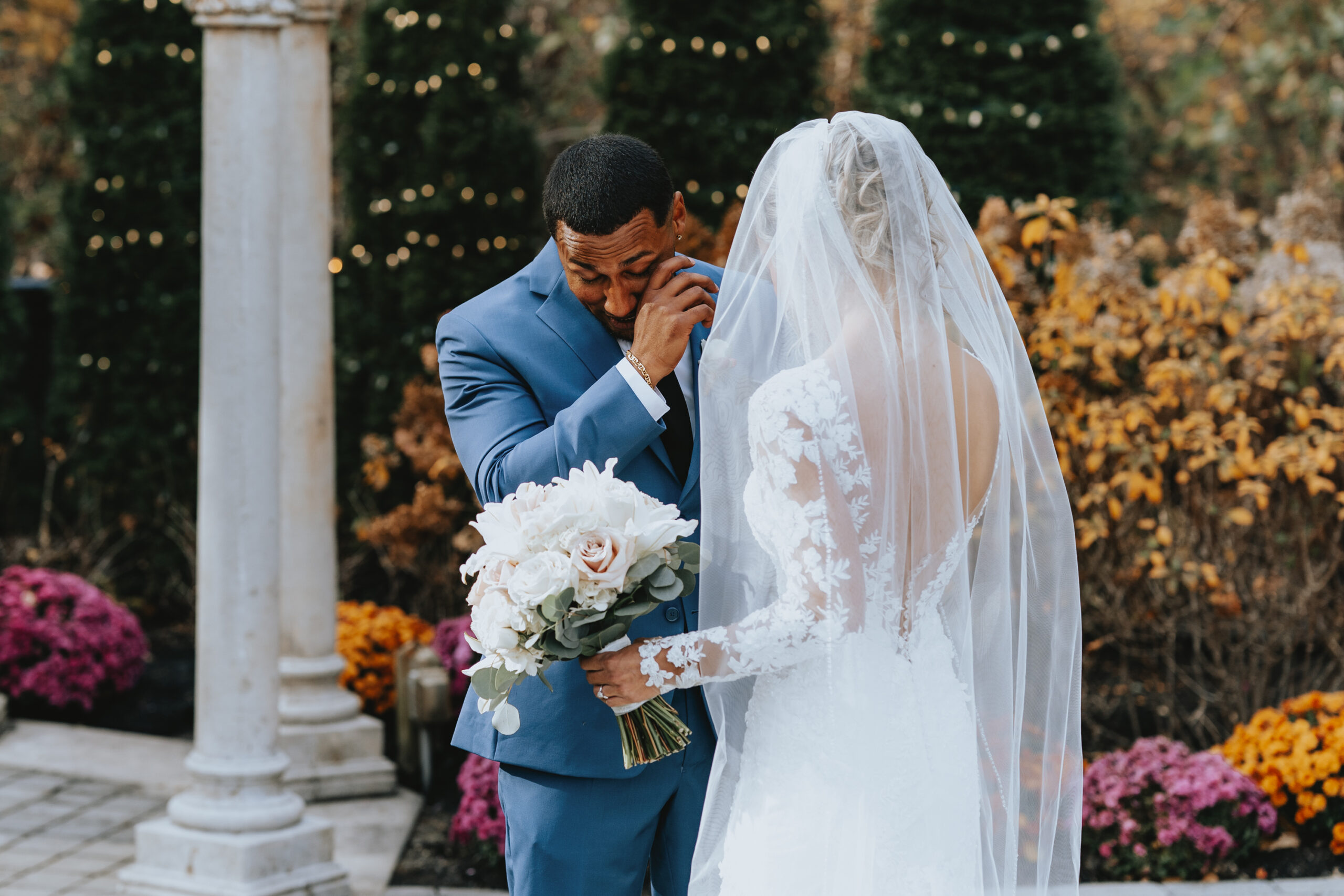 The groom cries as he faces the bride for the first time during their first look at the Hamilton Manor.