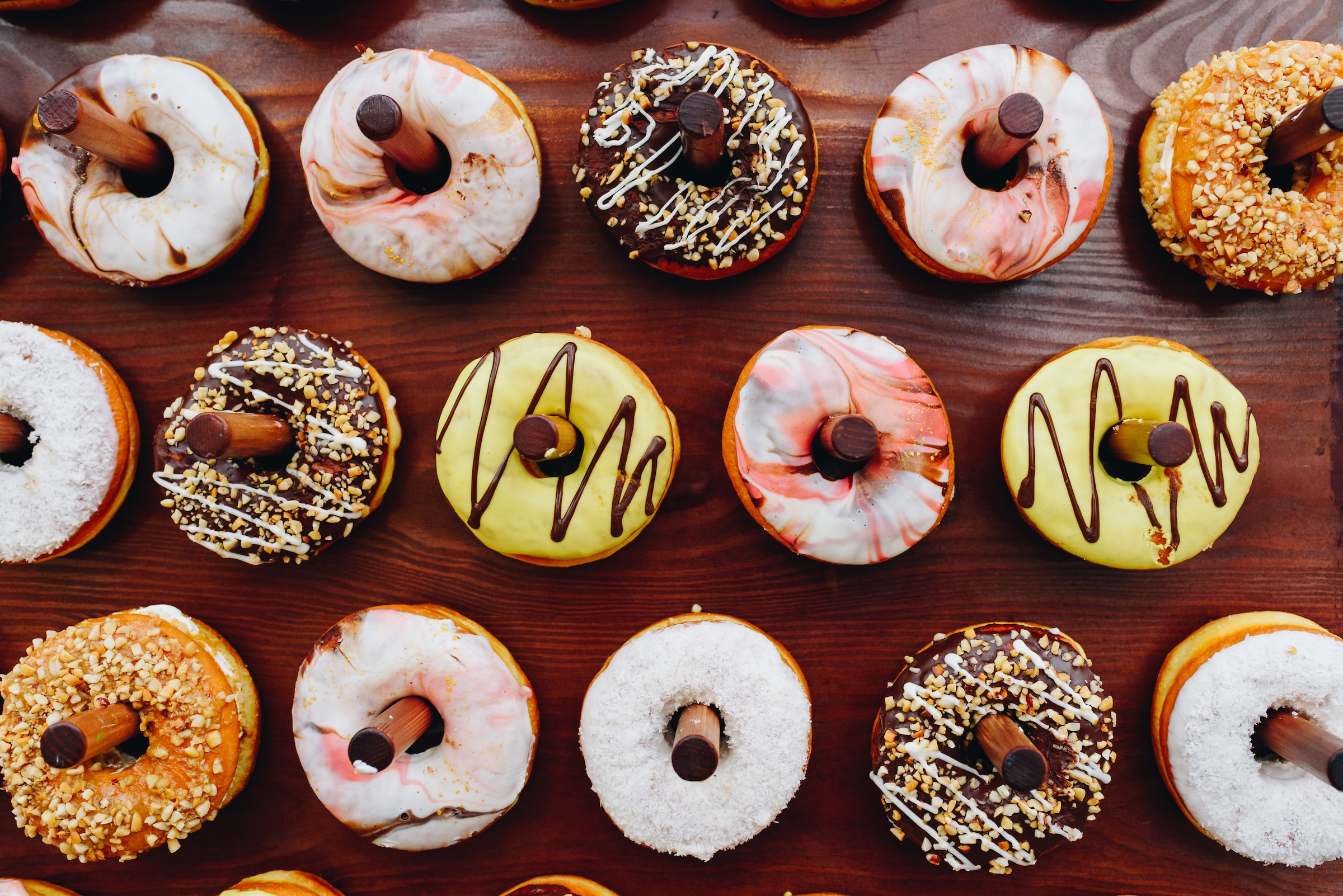 A doughnut wall is a great way to display dessert at your wedding.