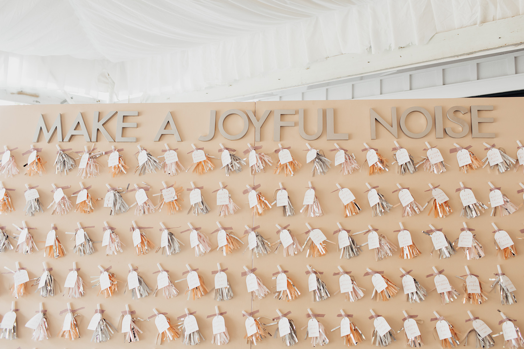 This noisemaker seating chart is a whimsical wedding decor idea.