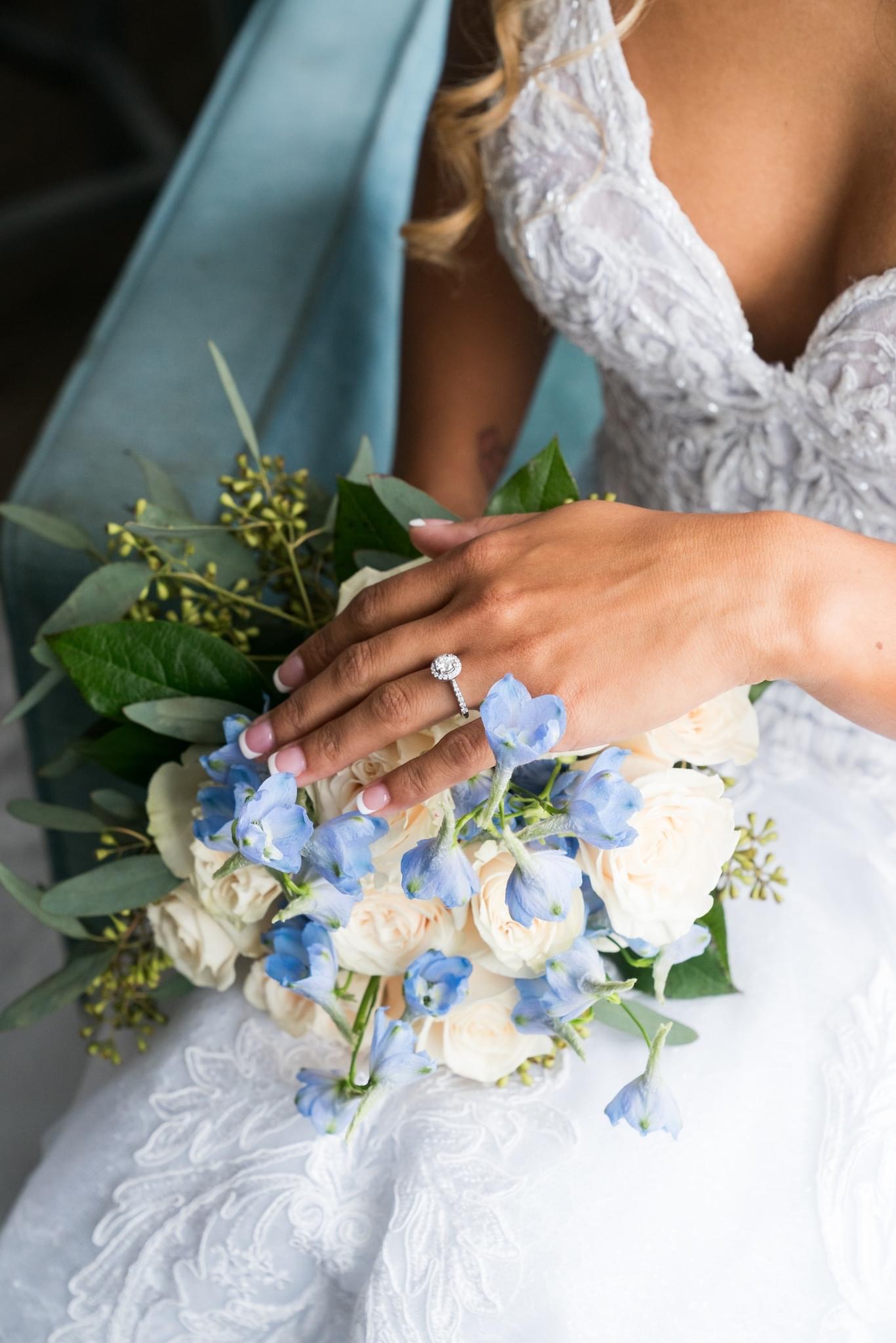 The bride holds her bouquet at her Crystal Point Yacht Club wedding.