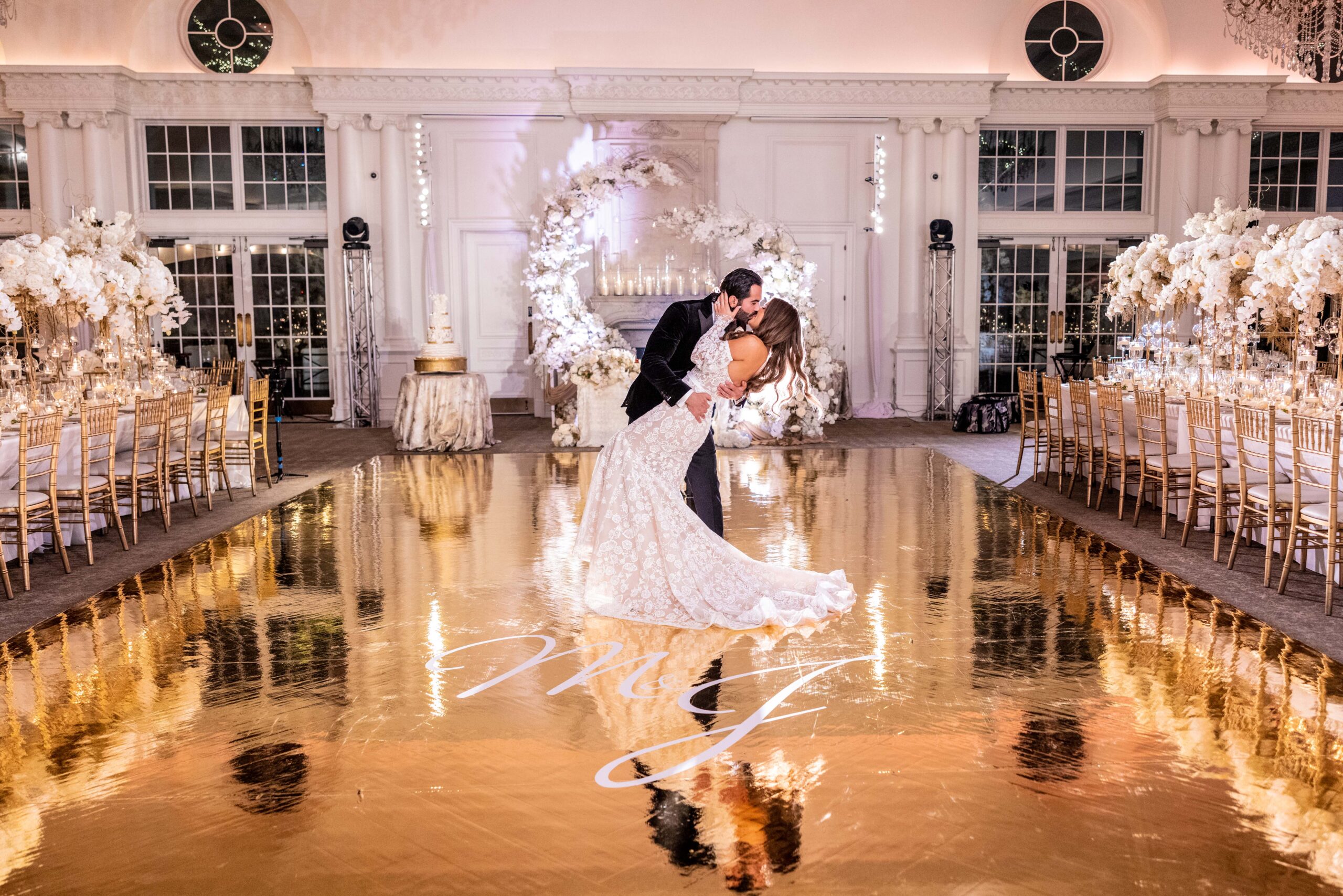 The groom dips the bride on the dancefloor at the Park Chateau.