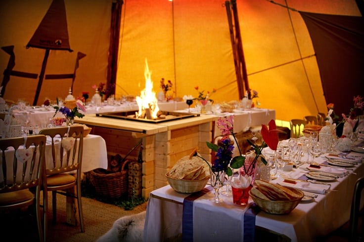 Open fire at teepee wedding glamping wedding