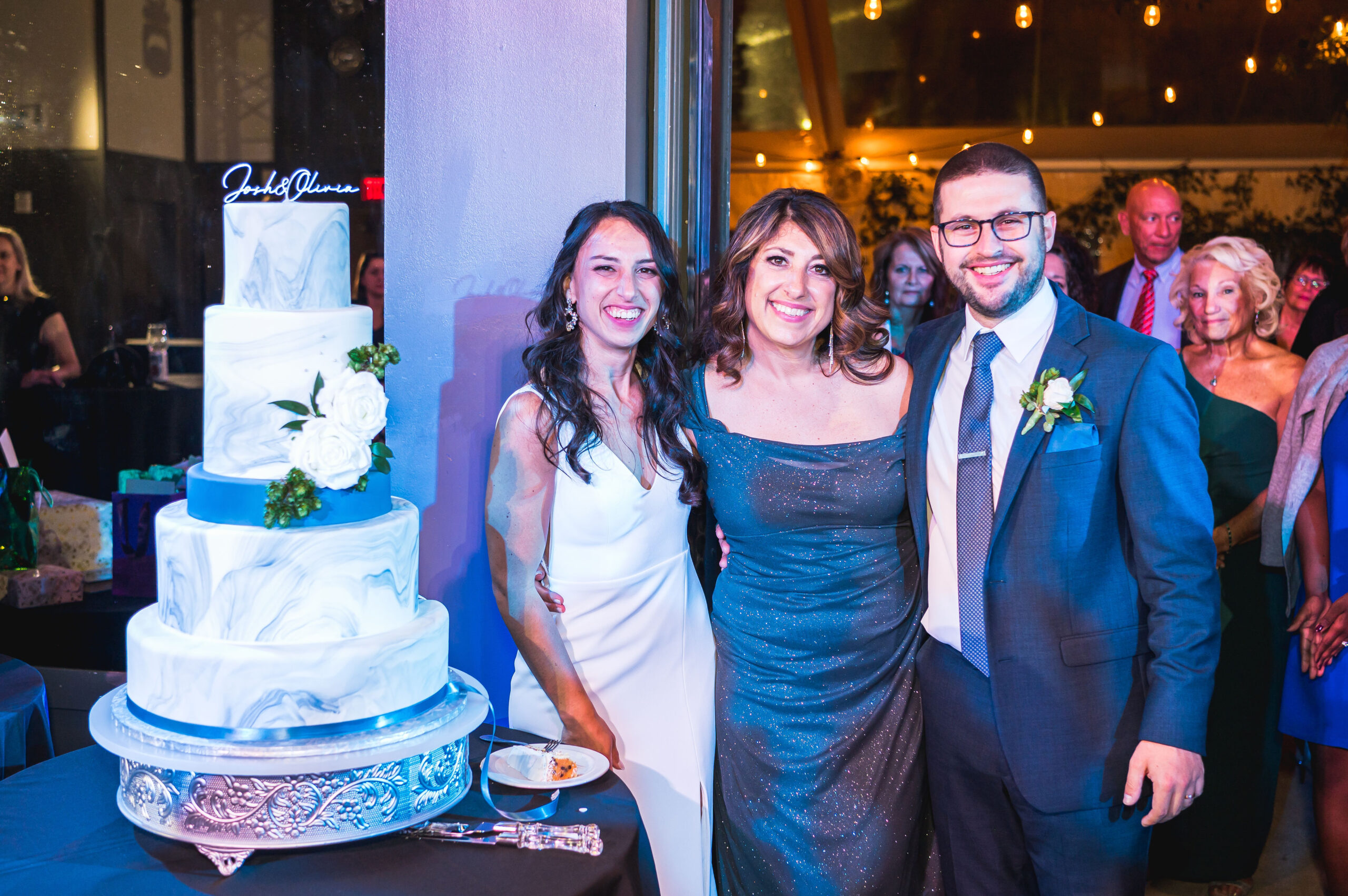 Chocolate Carousel owner Linda Posada with her daughter and son-in-law at their wedding at the Asbury Hotel.