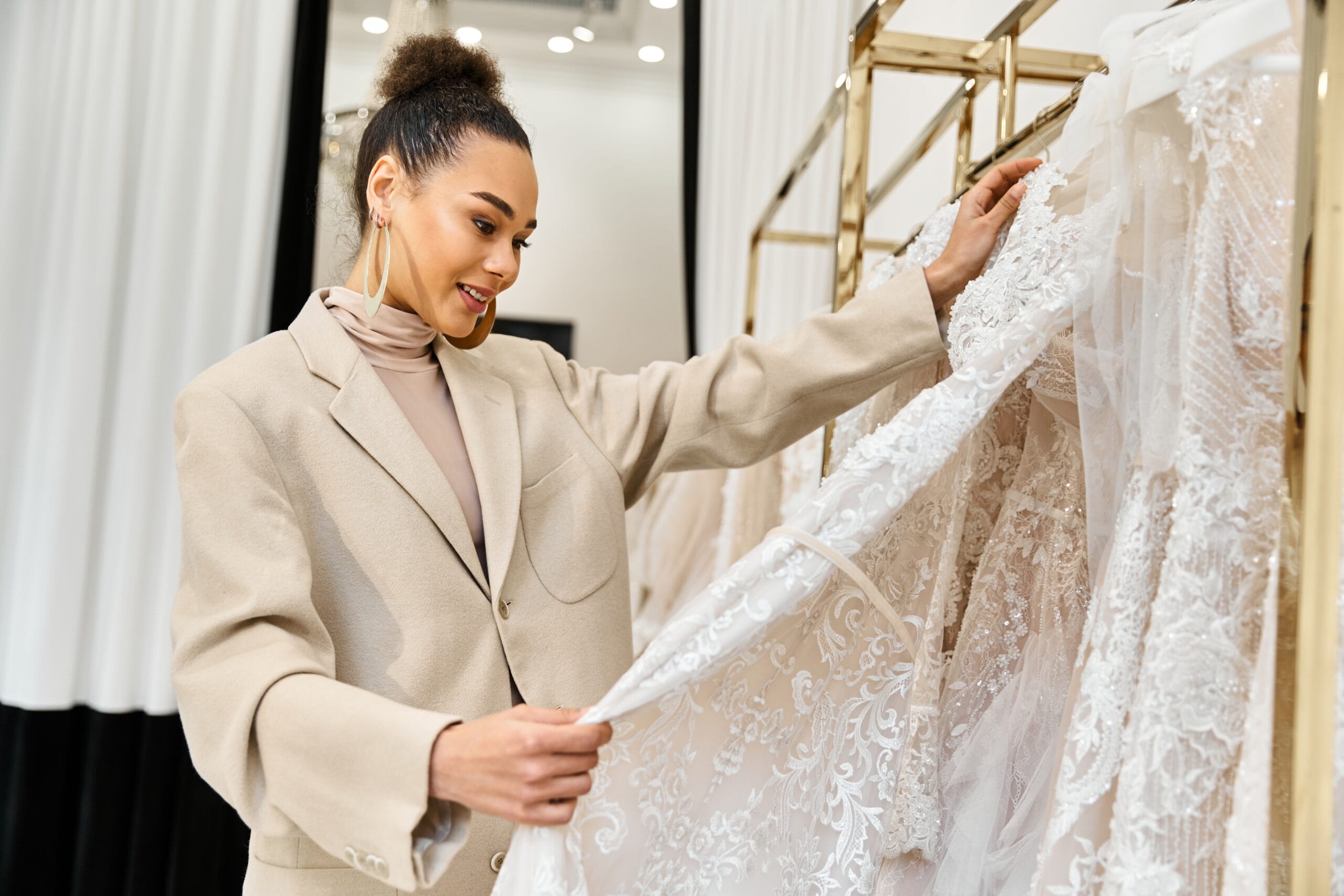 woman looking at wedding gown
