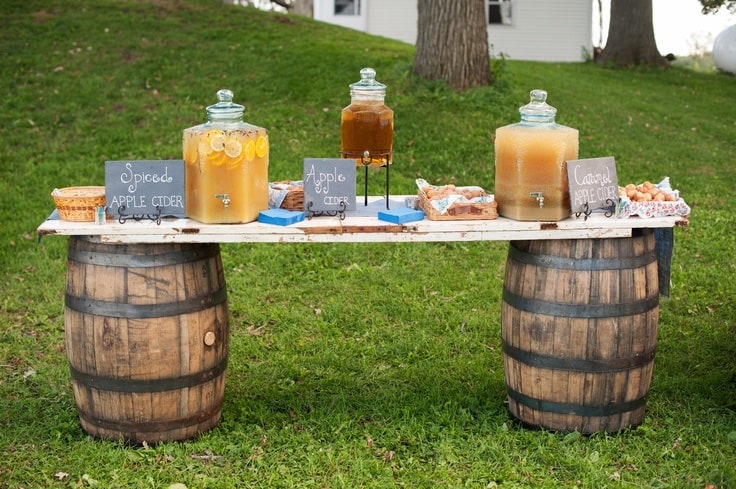 Apple cider and donut bar for fall wedding favors.